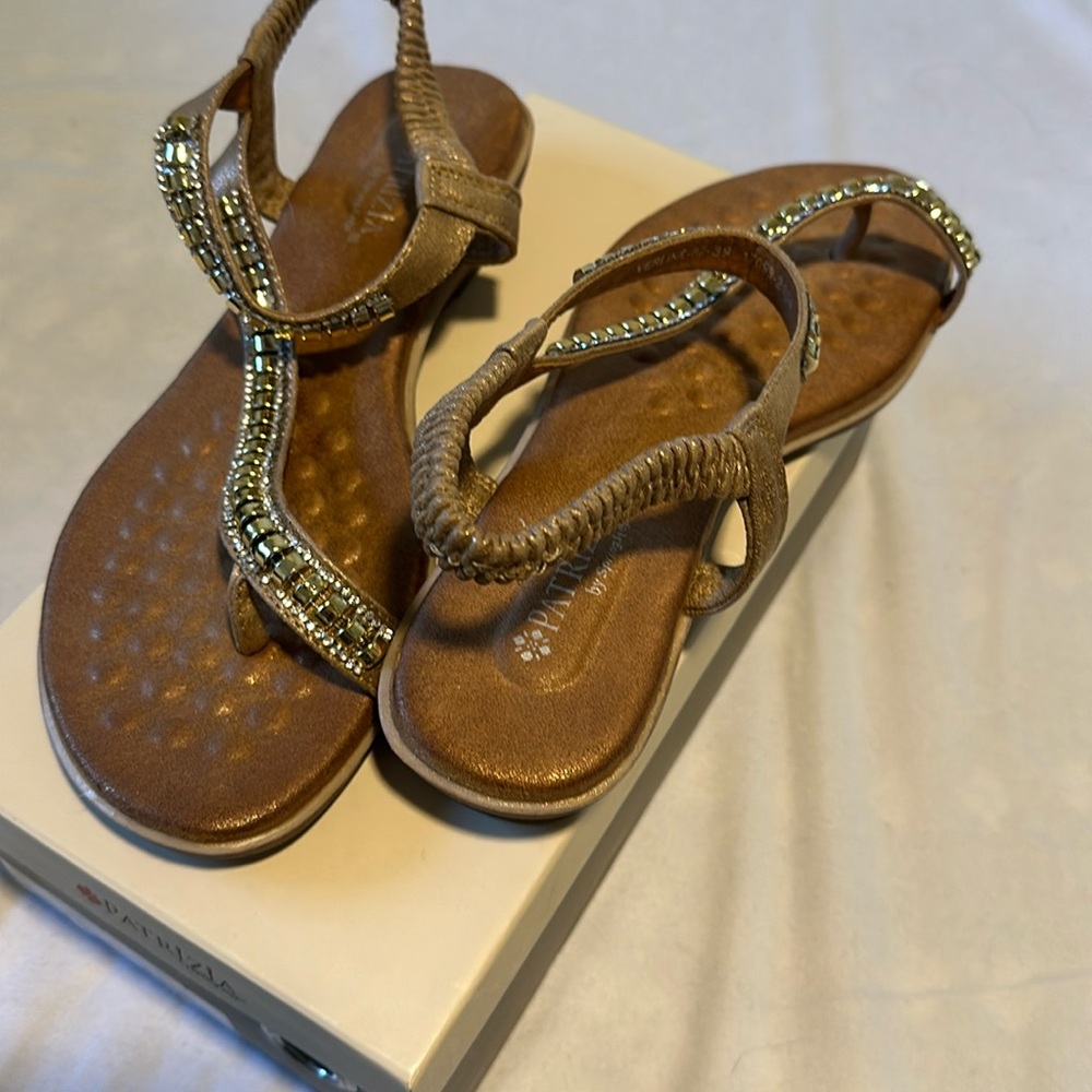 Patrizia, small wedge sandals size 8.5 worn one time. Beige with gold jewels.